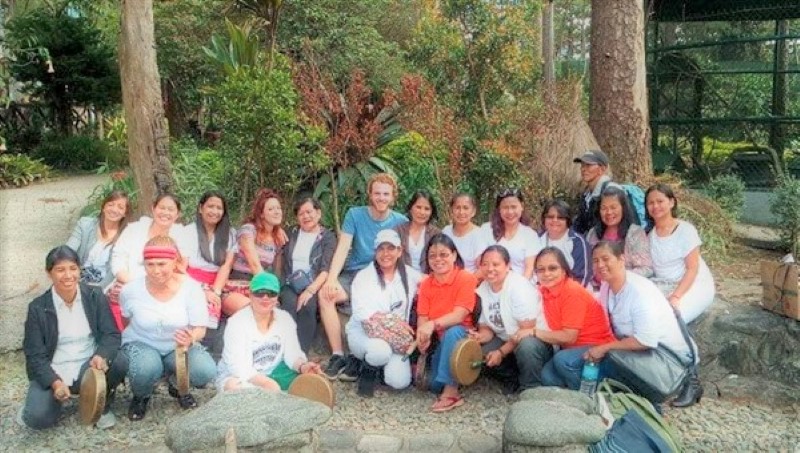 Myself and Ale sitting and sharing with a group of Filipino local women