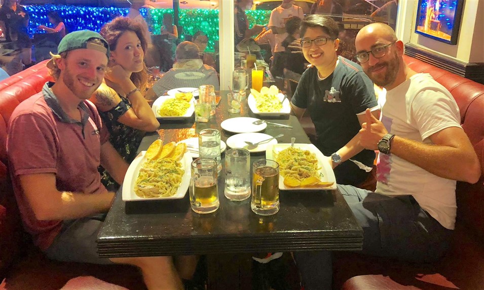 4 friends at a restaurant in Manila eating dinner