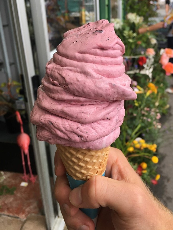 Closeup of big pink icecream on cone